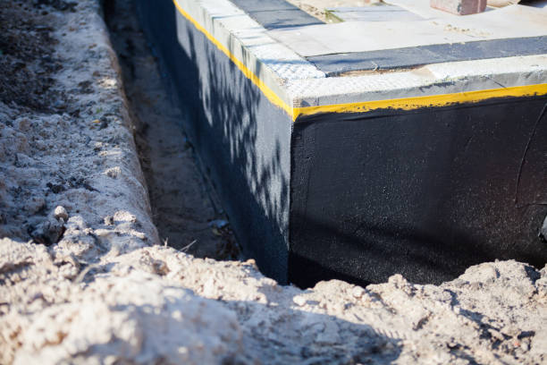 Professional Basement Waterproofing technician working in Smithville, NJ